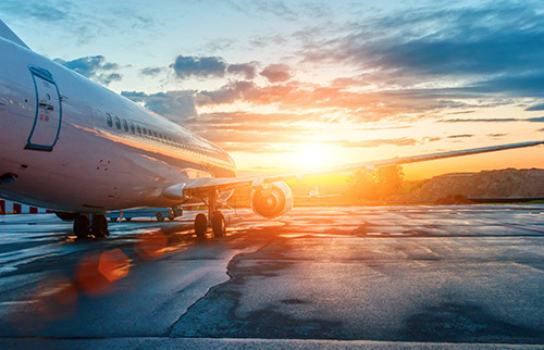 Airplane on runway with sunshine