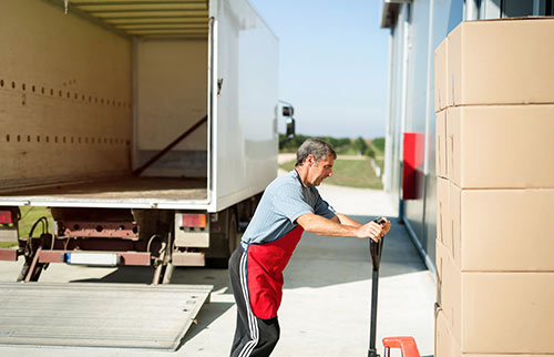  Air Cargo Courier employee unloading truck load